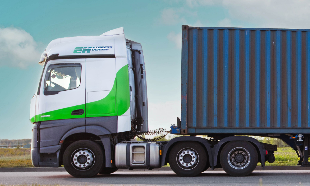 Truck driving on road, shows road transport capabilities